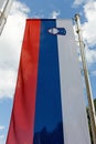 Slovenian Flag against a Blue Sky Royalty Free Stock Photo