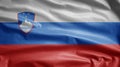 Slovenian flag waving in the wind. Close up of Slovenia banner blowing soft silk