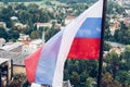 Slovenian national flag fluttering over Lake Bled Royalty Free Stock Photo