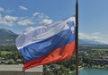 Slovenian national flag over Lake Bled and town Royalty Free Stock Photo