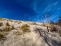 The Slovinski National Park - unique in Europe dune belt of spits with moving dunes, sunny day and blue sky