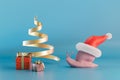 the slow approach of Christmas. a snail in a Christmas hat next to gifts on a blue background. 3D render Royalty Free Stock Photo