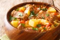 Slow beef stew with wine, potatoes, carrots and celery close-up in a bowl. horizontal Royalty Free Stock Photo