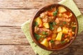 Slow beef stew with wine, potatoes, carrots and celery close-up in a bowl. horizontal top view Royalty Free Stock Photo