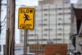 Slow children caution sign on a street Royalty Free Stock Photo