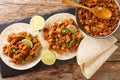 Slow Cooked Chilorio Sinaloan Chile Braised Pork served with tortilla closeup in the slate board. Horizcontal top view