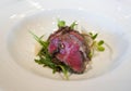 Slow cooked mini beef short ribs served on white plate. Sunday brunch main course dining Royalty Free Stock Photo