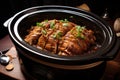 slow-cooked pork in a crockpot with sauce