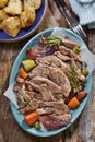 Slow cooked roast lamb with vegetables