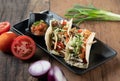 Korean short rib tacos with spring onion tomato salsa