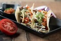 Slow cooked short ribs on tortillas with a spring onion tomato salsa Royalty Free Stock Photo