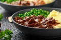 Slow Cooked Steak Diane Casserole with mushroom. mashed potatoes and green peas Royalty Free Stock Photo