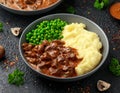 Slow Cooked Steak Diane Casserole with mushroom. mashed potatoes and green peas Royalty Free Stock Photo