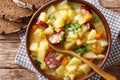 Slow cooker German potato soup kartoffelsuppe close-up on a pl