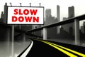 Slow down road sign on highway in big city Royalty Free Stock Photo