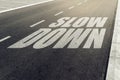 Slow down speed limit sign on highway Royalty Free Stock Photo