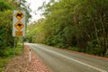 Slow Down traffic sign with images of koala and kangaroo.