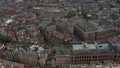 Slow forward Aerial Establisher of Amsterdam Cityscape and Royal Palace on Cloudy Day