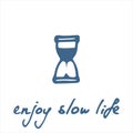 Slow life concept. Hand drawn phrase enjoy slow life and hourglass icon