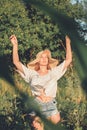 Slow Living concept New Lifestyle Trend. Relaxing young woman with lowers in nature, in corn, sunflower field Royalty Free Stock Photo