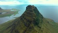 Slow motion aerial view of Kirkjufell mountain, Iceland and Atlantic ocean