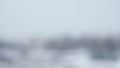 Slow motion bokeh background of snowfall with shallow depth of field Royalty Free Stock Photo