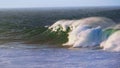 Slow motion breaking surf rolling towards coast. Powerful foamy waves crashing Royalty Free Stock Photo