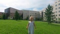 SLOW MOTION CLOSE UP: Playful baby girl in nature while singing her favorite children`s song or shouts `Hurray!` while at the park