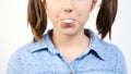 Slow motion close up portrait of cute girl chewing gum and blowing a bubblegum bubble ballon