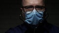 Slow motion with doctor protected with face mask and gloves against viruses using a stethoscope for medical consultation in a resp