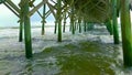 Slow motion hurricane waves wreak havoc on pilings under pier