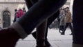 SLOW MOTION: Pedestrians cross busy city street in munich, germany. At daytime on cold winter, stationary camera. 120