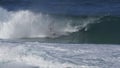 A slow motion shot of a surfer stalling for a tube ride at the banzi pipeline on the north shore of oahu in hawaii