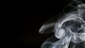 SLOW MOTION: Smoke slowly lifts up on a black background right