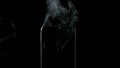 SLOW MOTION: Smoke from smartphone on a black background - Center