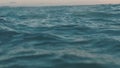 Slow motion video of sea water surface. Dackground for movie credits or intro