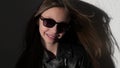 Slow motion video of a stylish child in leather jacke with glasses