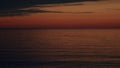 Water In Ocean With Sunset Reflected On Waves. View Of Calm Waves. Abstract Nature Background.