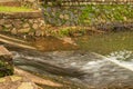 slow motion of water sliding from a small dam Royalty Free Stock Photo