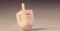 Slow motion of a Hanukka dreidel spinning