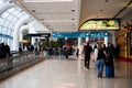 Slow-moving conveyor or autowalk with diverse group passenger traveler inside Charlotte Douglas International Airport, multiethnic