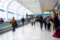 Slow-moving conveyor or autowalk with diverse group passenger traveler inside Charlotte Douglas International Airport, multiethnic