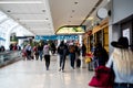 Slow-moving conveyor or autowalk with diverse group passenger traveler inside Charlotte Douglas International Airport, multiethnic