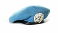 Slow push in to United Nations Peacekeeper`s beret