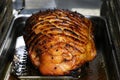 Slow roasted gammon in the oven Royalty Free Stock Photo