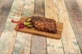 Slow-roasted piece of beef with barbecue sauce, pickled gherkins