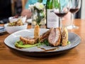 Slow roasted pork belly with red wine and side dishes Royalty Free Stock Photo