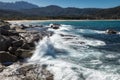 Waves crashing onto rocks near Algajola beach in Corsica Royalty Free Stock Photo