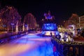 Night scenery at ice rink with people enjoy ice skating at Heumarkt, famous Christmas market square in KÃÂ¶ln. Royalty Free Stock Photo