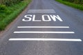 Slow Sign freshly painted on road Royalty Free Stock Photo